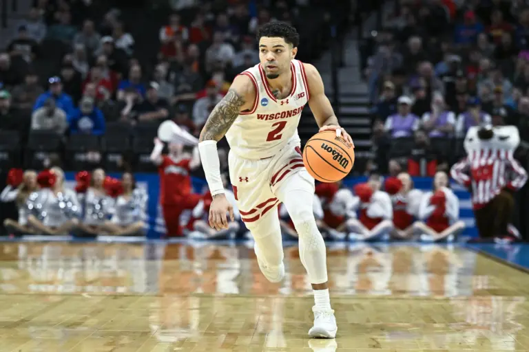 Mar 19, 2026; Portland, OR, USA; Wisconsin Badgers guard Nick Boyd (2) dribbles against the High Point Panthers during the first half of a first round game of the men's 2026 NCAA Tournament at Moda Center. Mandatory Credit: Craig Strobeck-Imagn Images