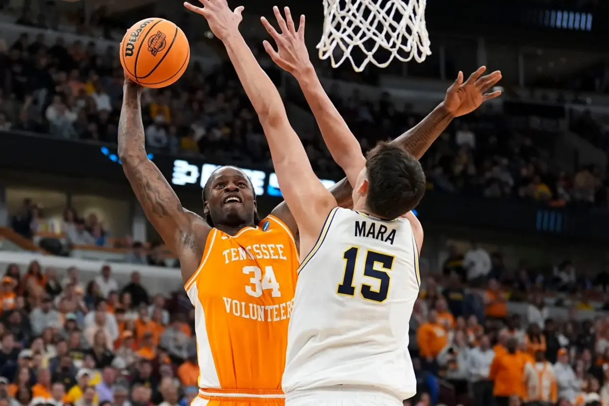 Tennessee forward Felix Okpara (34) tries to score while guarded by Michigan center Aday Mara (15) during a NCAA Tournament Elite 8 game at the United Center in Chicago on March 29, 2026. Okpara is the 46th pick in the 2026 NBA Draft, getting traded to the Washington Wizards on the second night of the draft.