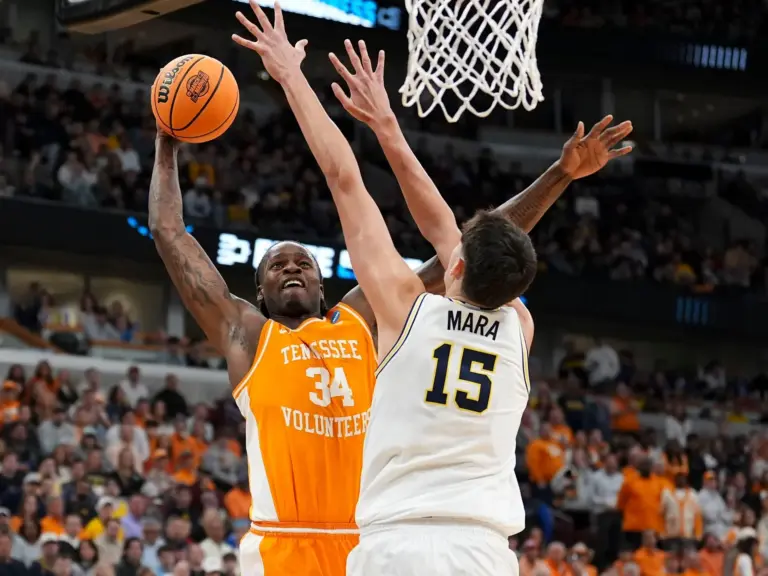 Tennessee forward Felix Okpara (34) tries to score while guarded by Michigan center Aday Mara (15) during a NCAA Tournament Elite 8 game at the United Center in Chicago on March 29, 2026. Okpara is the 46th pick in the 2026 NBA Draft, getting traded to the Washington Wizards on the second night of the draft.