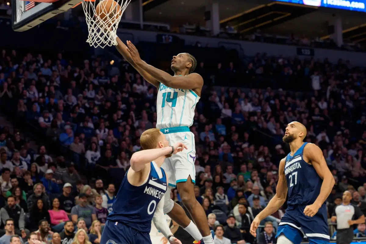 Charlotte Hornets forward Moussa Diabate (14) shoots over Minnesota Timberwolves guard Donte DiVincenzo (0) in the fourth quarter at Target Center.