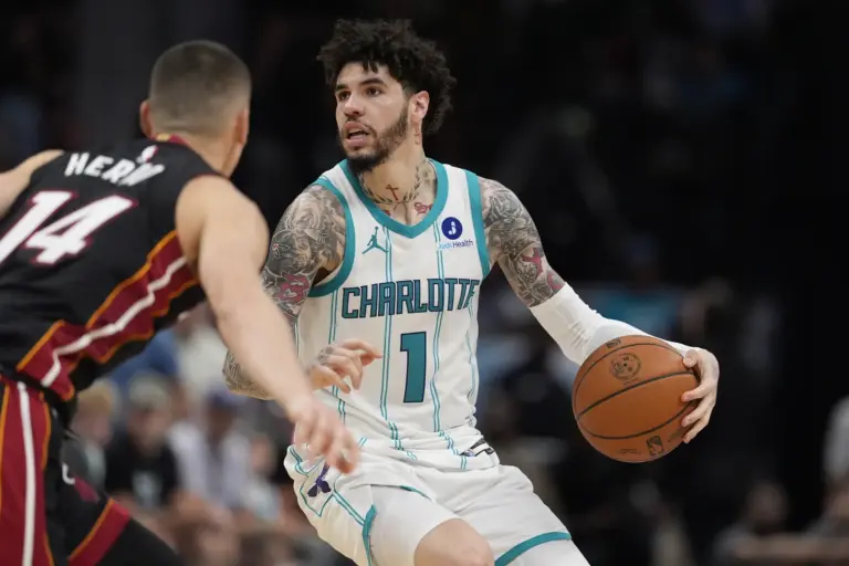 Apr 14, 2026; Charlotte, North Carolina, USA; Charlotte Hornets guard LaMelo Ball (1) looks to pass defended by Miami Heat guard Tyler Herro (14) during the second half during the play-in rounds between the Charlotte Hornets and the Miami Heat of the 2026 NBA Playoffs at Spectrum Center. Mandatory Credit: Jim Dedmon-Imagn Images. They will have picks 14 and 18 in the 2026 NBA Draft.