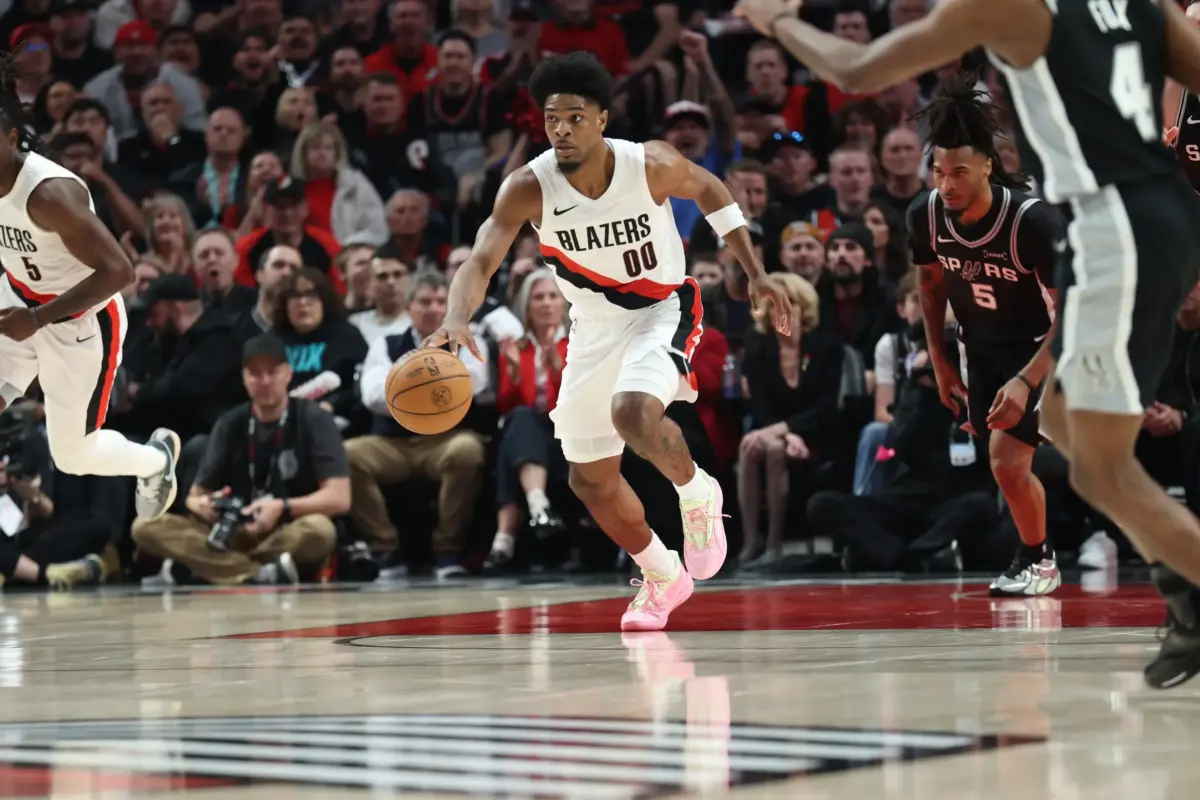 Apr 24, 2026; Portland, Oregon, USA; Portland Trail Blazers guard Scoot Henderson (00) brings the ball up the court against the San Antonio Spurs during the first half during game three of the first round of the 2026 NBA Playoffs at Moda Center. Mandatory Credit: Jaime Valdez-Imagn Images. He can be the Blazers' X-factor next season.
