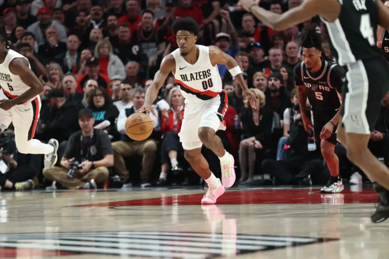 Apr 24, 2026; Portland, Oregon, USA; Portland Trail Blazers guard Scoot Henderson (00) brings the ball up the court against the San Antonio Spurs during the first half during game three of the first round of the 2026 NBA Playoffs at Moda Center. Mandatory Credit: Jaime Valdez-Imagn Images. He can be the Blazers' X-factor next season.
