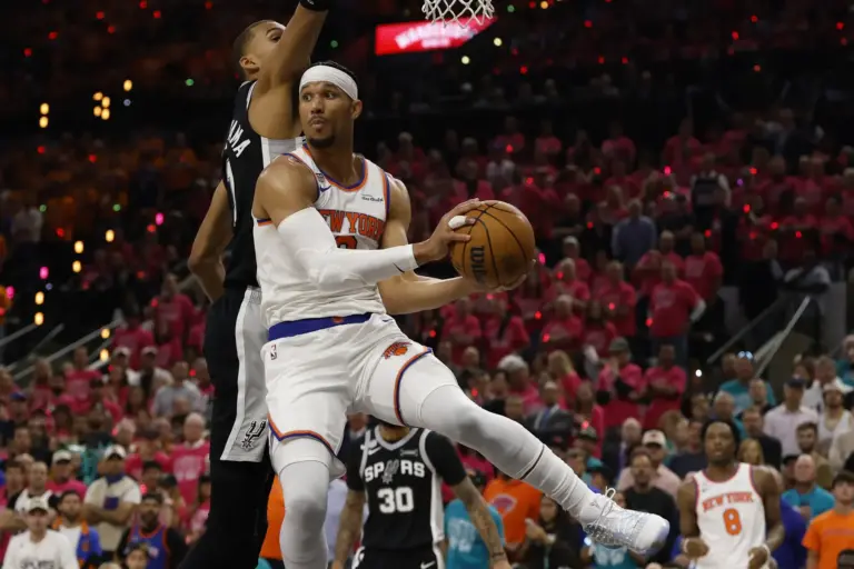New York Knicks guard Josh Hart (3) grabs a rebound against San Antonio Spurs forward Victor Wembanyama (1) in the first half during game one of the 2026 NBA Finals at Frost Bank Center.