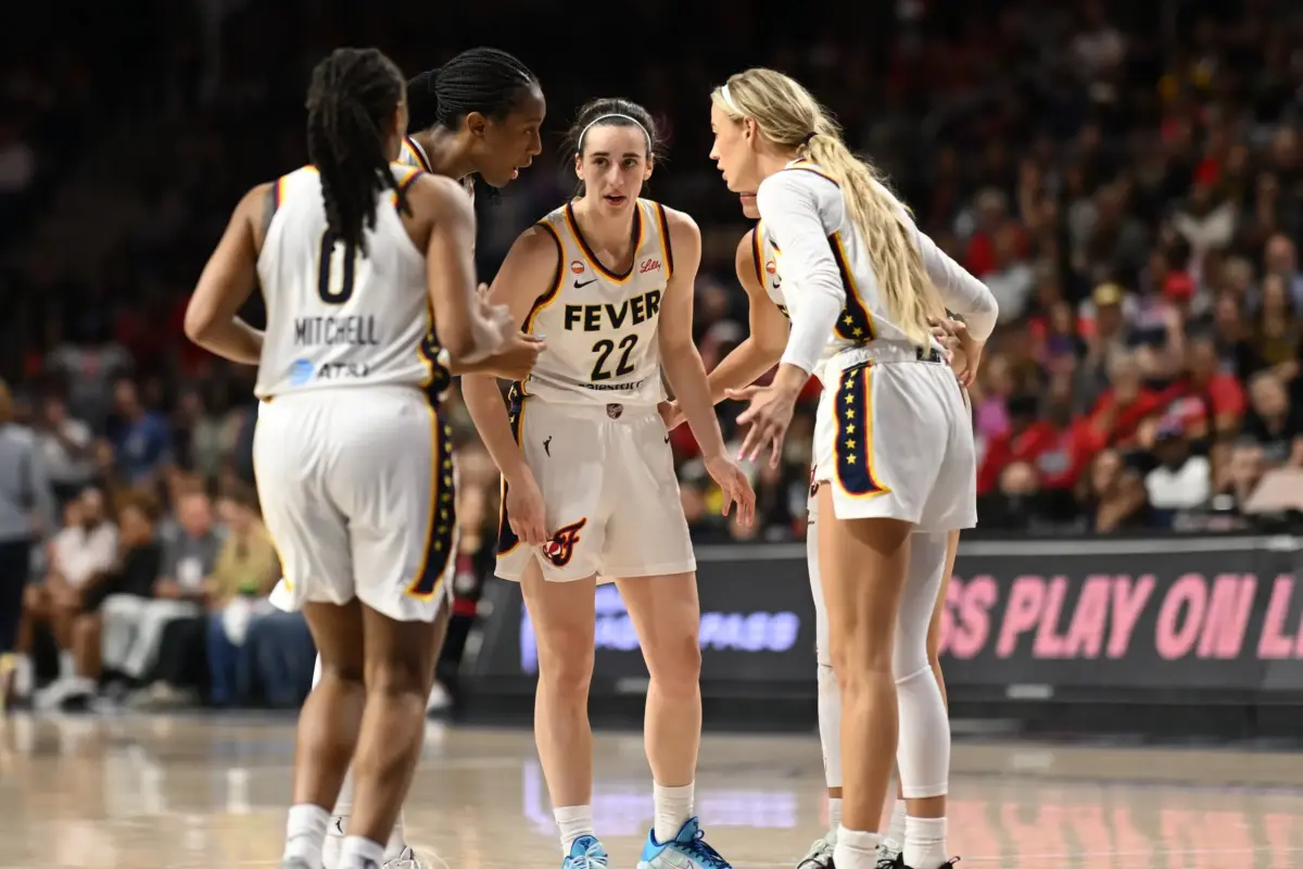 Jun 8, 2026; Washington, District of Columbia, USA; Indiana Fever guard Caitlin Clark (22) huddles up with her teammates against the Washington Mystics during the fourth quarter at CareFirst Arena. Mandatory Credit: Rafael Suanes-Imagn Images. The Sky vs Fever game looks to be an exciting match.