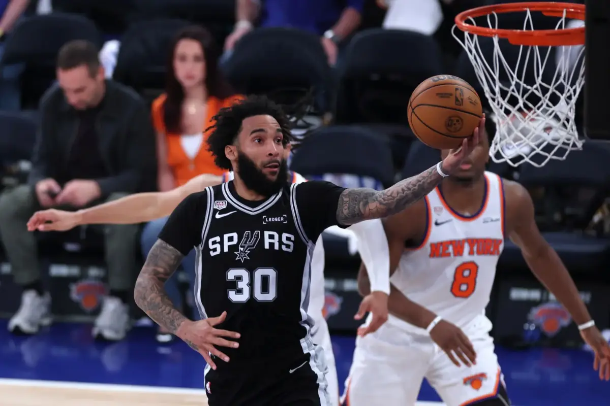 Jun 8, 2026; New York, New York, USA; San Antonio Spurs forward Julian Champagnie (30) shoots against the New York Knicks in the third quarter during game three of the 2026 NBA Finals at Madison Square Garden. Mandatory Credit: Vincent Carchietta-Imagn Images. The Spurs recent signings, like with Champagnie, gives them the best forward room in the league.