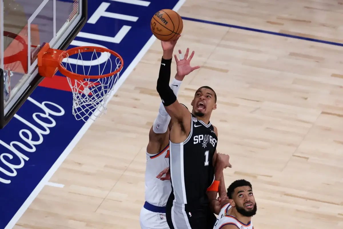 Jun 8, 2026; New York, New York, USA; San Antonio Spurs forward Victor Wembanyama (1) shoots the ball against New York Knicks center Karl-Anthony Towns (32) during game three of the 2026 NBA Finals in the fourth quarter at Madison Square Garden. Mandatory Credit: Wendell Cruz-Imagn Images