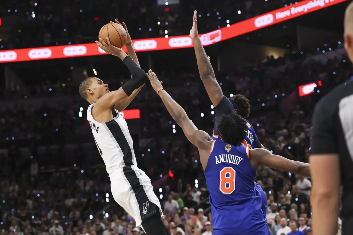 Jun 13, 2026; San Antonio, Texas, USA; San Antonio Spurs forward Victor Wembanyama (1) shoots the ball over New York Knicks forward Og Anunoby (8) during the third quarter during game five of the 2026 NBA Finals at Frost Bank Center. Mandatory Credit: Geoff Burke-Imagn Images