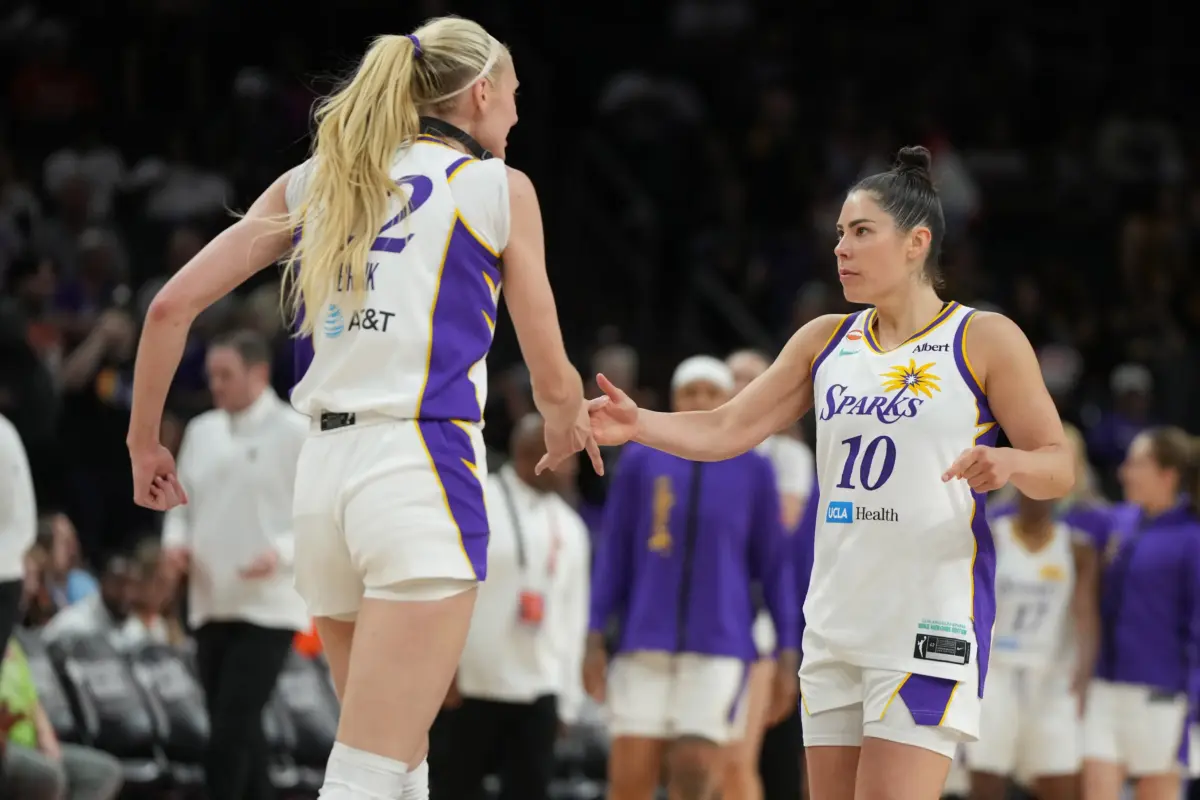 Jun 13, 2026; Phoenix, Arizona, USA; Los Angeles Sparks forward Cameron Brink (22) and guard Kelsey Plum (10) celebrate after defeating the Phoenix Mercury in overtime at Mortgage Matchup Center. Mandatory Credit: Rick Scuteri-Imagn Images. The Sparks vs Valkyries game looks to be an exciting match between two California teams.