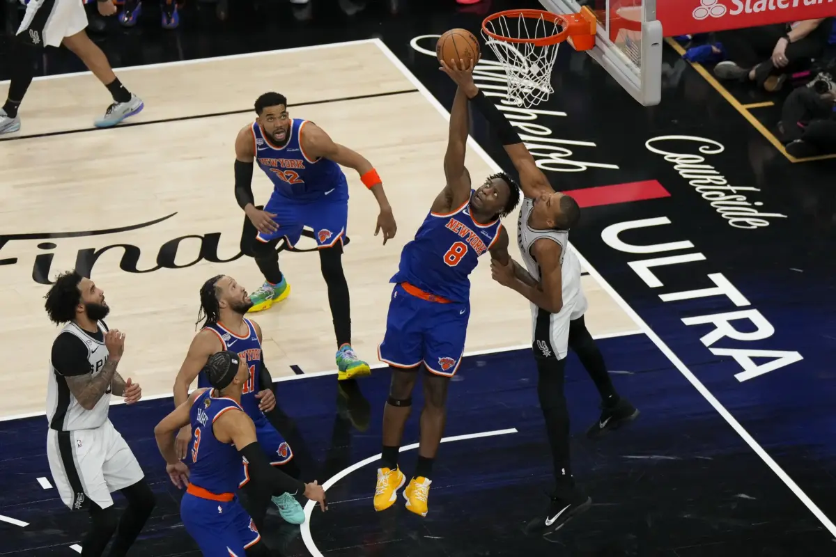 Jun 13, 2026; San Antonio, Texas, USA; New York Knicks forward Og Anunoby (8) and San Antonio Spurs forward Victor Wembanyama (1) leap for the ball during the fourth quarter during game five of the 2026 NBA Finals at Frost Bank Center. Mandatory Credit: Scott Wachter-Imagn Images