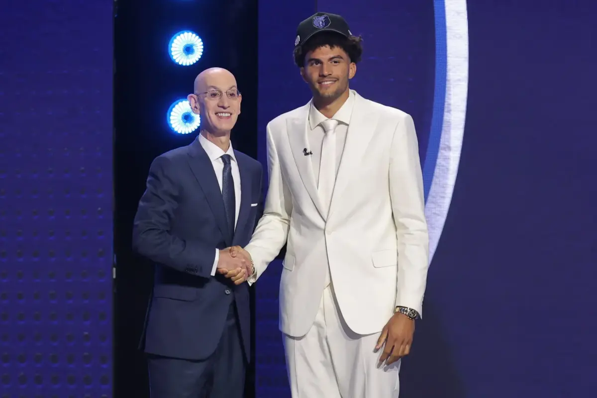 Jun 23, 2026; New York, NY, USA; NBA commissioner Adam Silver greets the third pick in the 2026 NBA draft, Duke forward Cameron Boozer after he was selected by the Memphis Grizzlies at Barclays Center. Mandatory Credit: Brad Penner-Imagn Images
