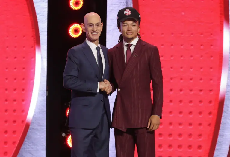 Jun 23, 2026; New York, NY, USA; NBA commissioner Adam Silver greets the eighth pick in the 2026 NBA draft, Houston guard Kingston Flemings after he was selected by the Atlanta Hawks at Barclays Center. Mandatory Credit: Brad Penner-Imagn Images