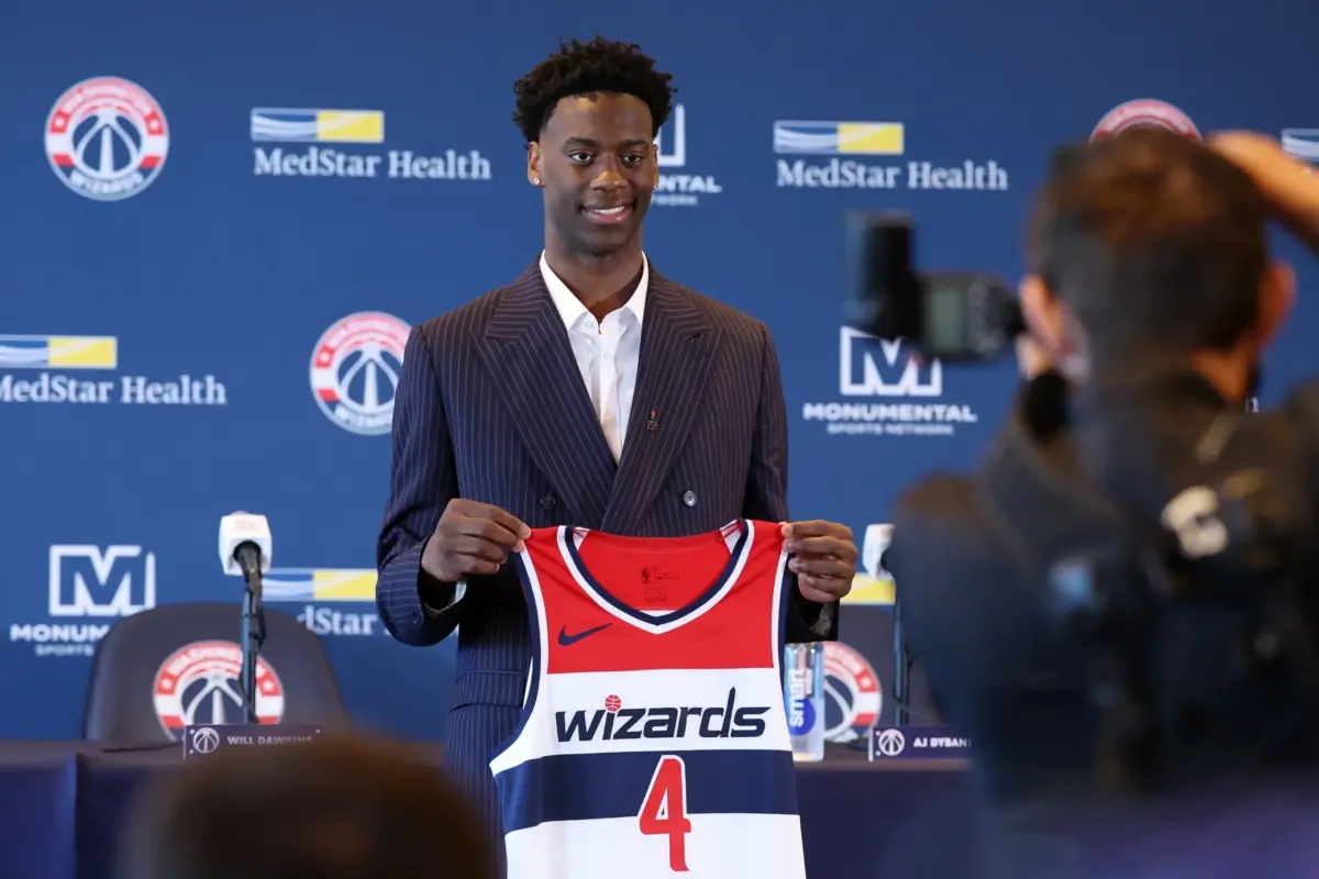Jun 25, 2026; Washington, DC, USA; Washington Wizards first round draft pick and number one overall pick AJ Dybantsa poses for a photo with his jersey during a press conference at InterContinental Hotel. Mandatory Credit: Amber Searls-Imagn Images