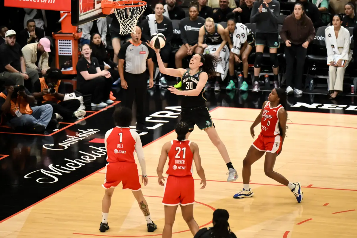 Jun 30, 2026; Brooklyn, New York, USA; New York Liberty forward Breanna Stewart (30) drives past Las Vegas Aces guard Jackie Young (0) during the second half at Barclays Center. Mandatory Credit: John Jones-Imagn Images. The Liberty ultimately got their Commissioner's Cup Final Win over the Aces.