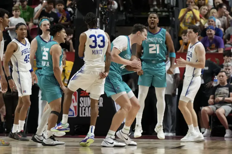 Jul 12, 2025; Las Vegas, NV, USA; Charlotte Hornets center Ryan Kalkbrenner (11) and guard M.J. Walker Jr. (21) celebrate defeating the Philadelphia 76ers at Thomas & Mack Center. Mandatory Credit: Candice Ward-Imagn Images. Regardless of who they face on the Hornets 2026 Summer League schedule, Charlotte will look to defend their Summer League title.