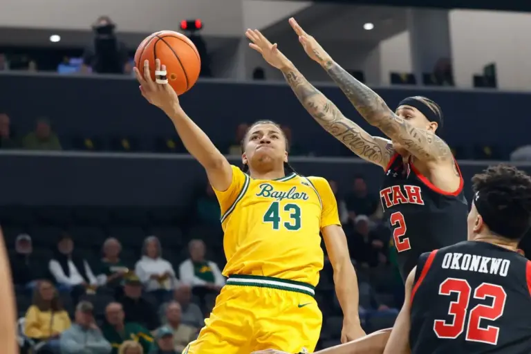 Mar 7, 2026; Waco, Texas, USA; Baylor Bears guard Cameron Carr (43) scores a layup as Utah Utes guard Terrence Brown (2) defends during the first half at Paul and Alejandra Foster Pavilion. Mandatory Credit: Chris Jones-Imagn Images. Carr has been playing well in Summer League.