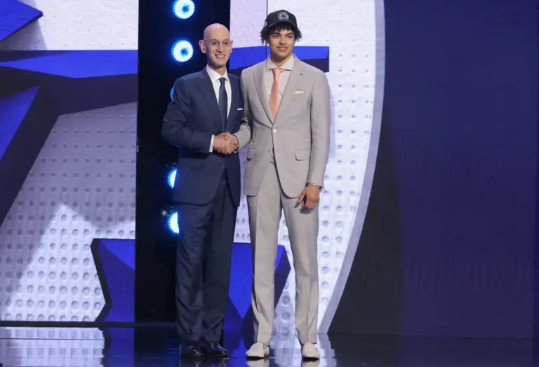 Jun 23, 2026; New York, NY, USA; NBA commissioner Adam Silver greets the fifth pick in the 2026 NBA draft, Illinois guard Keaton Wagler after he was selected by the Los Angeles Clippers at Barclays Center. Mandatory Credit: Brad Penner-Imagn Images. Wagler highlights the Clippers' Summer League team.
