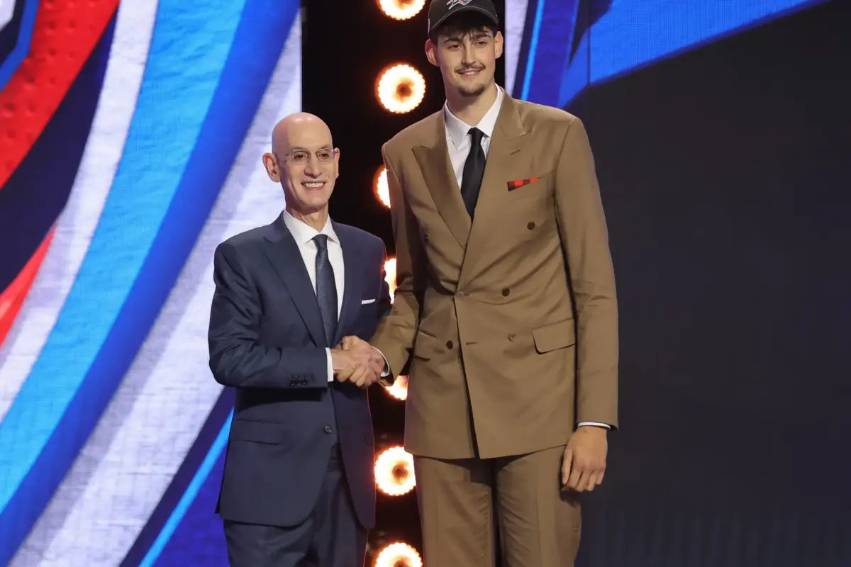 Jun 23, 2026; New York, NY, USA; NBA commissioner Adam Silver greets the twelfth pick in the 2026 NBA draft, Michigan center Aday Mara after he was selected by the Oklahoma City Thunder at Barclays Center. Mandatory Credit: Brad Penner-Imagn Images. Mara joins Bennett Stirtz and Otega Oweh on the Thunder's Summer League team.