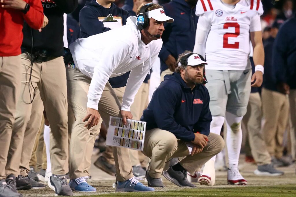 Nov 23, 2023; Starkville, Mississippi, USA; Mississippi Rebels head coach Lane Kiffin (left) and Mississippi Rebels defensive coordinator Pete Golding (right) watch during the second half against the Mississippi State Bulldogs at Davis Wade Stadium at Scott Field. Mandatory Credit: Petre Thomas-USA TODAY Sports