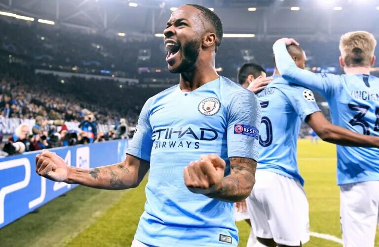 Photograph of Raheem Sterling celebrating a goal