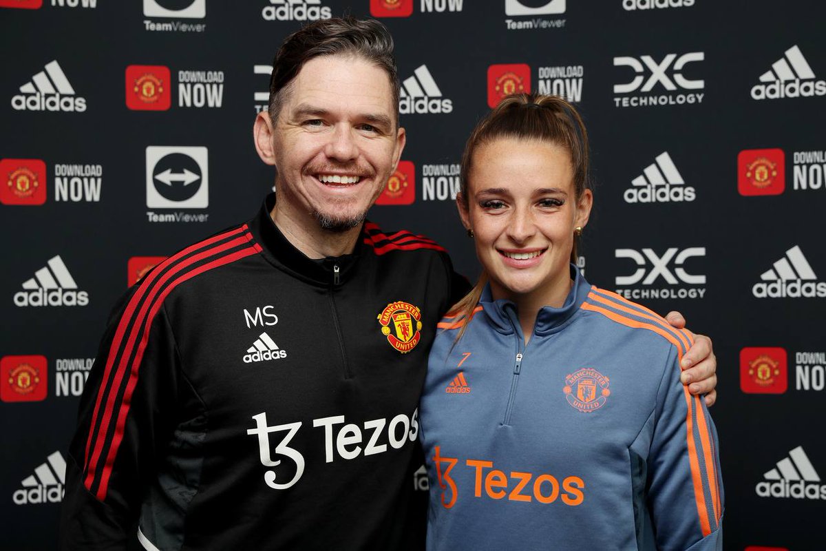 Manager Marc Skinner poses with Ella Toone after she signs new Manchester United Women contract