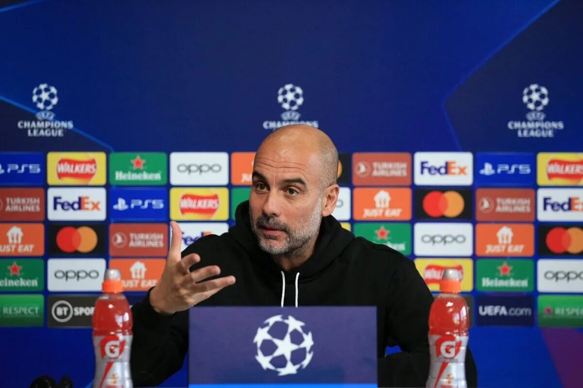 Manchester City manager Pep Guardiola talking to the media