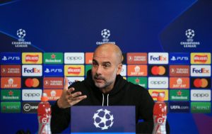 Manchester City manager Pep Guardiola talking to the media