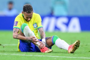 Neymar, pictured injured on the pitch, is out of Brazil predicted lineup