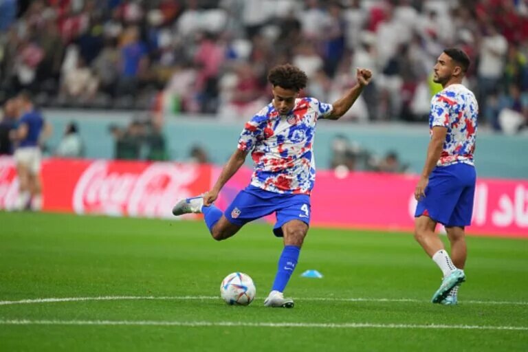 Tyler Adams, pictured shooting, will appear in USA vs Iran