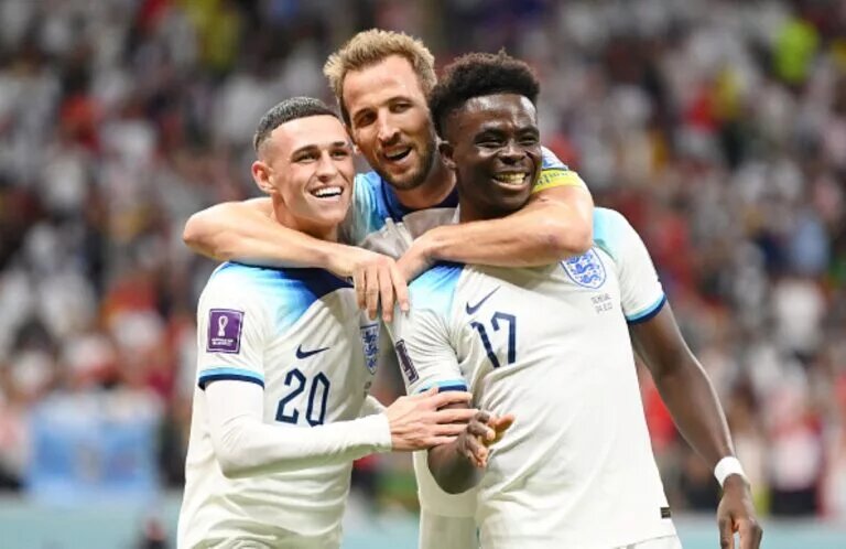 Harry Kane, Phil Foden and Bukayo Saka celebrating at the World Cup, all expected to play in England vs France