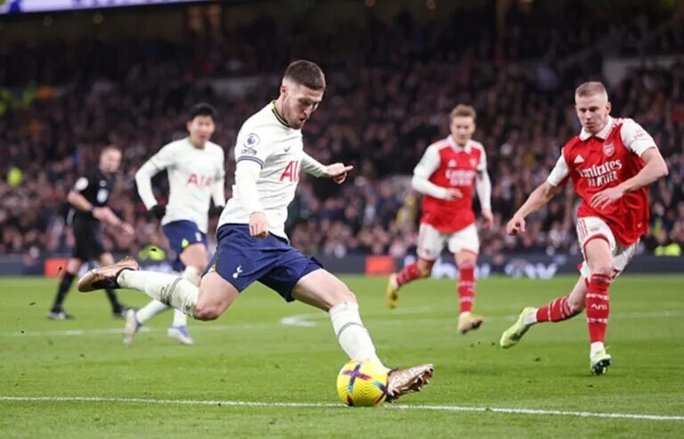 Matt Doherty attempting a cross against Arsenal