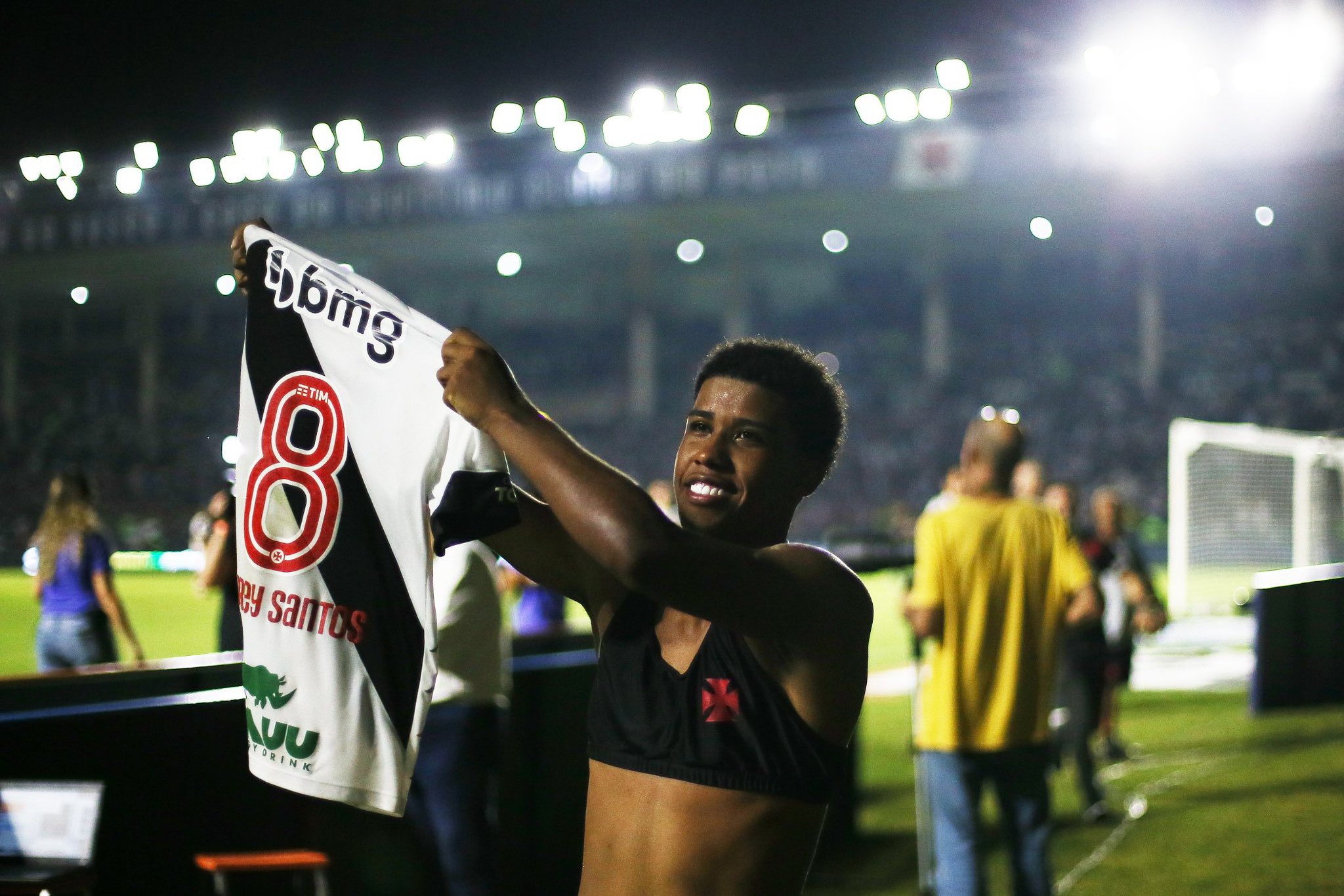 Incoming Chelsea wonderkid Andrey Santos holds his number 8 shirt aloft