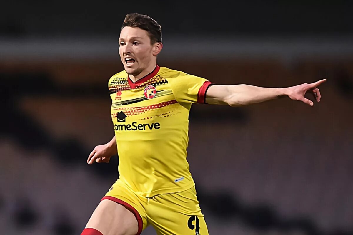 Striker Caolan Lavery runs and points during match