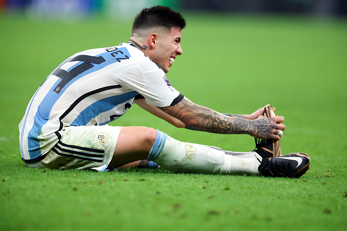 Argentina Midfielder Enzo Fernandez relieves cramp in his left foot
