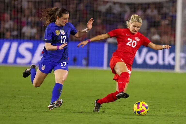 CanWNT Forward, Cloe Lacasse, Keeps the Ball Away From USWNT Midfielder, Andi Sullivan, at Exploria Stadium