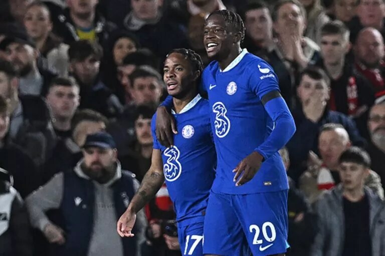 Denis Zakaria celebrates a goal with Raheem Sterling