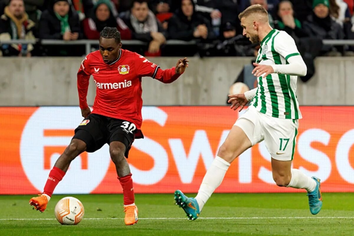 Jeremie Frimpong attempts to take the ball past a defender