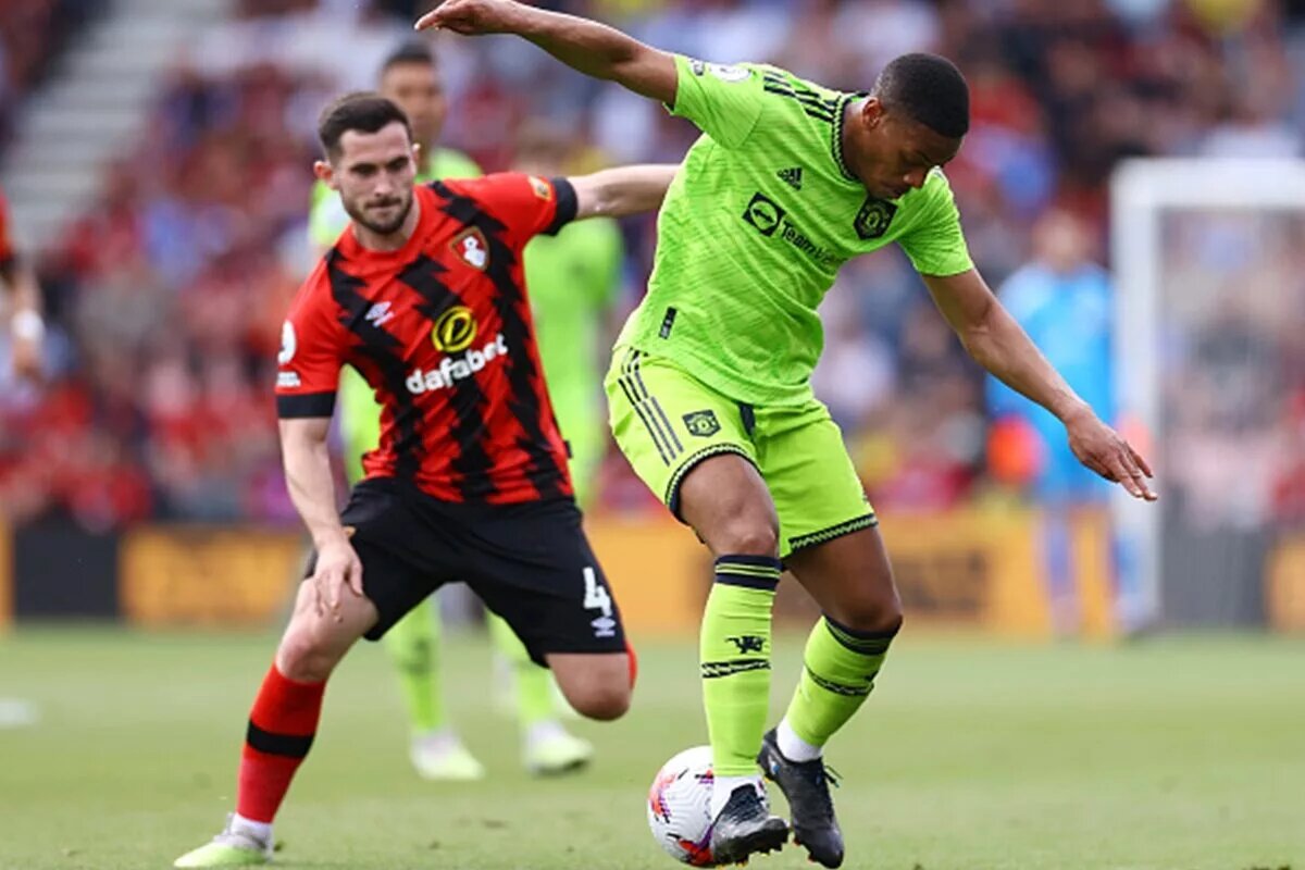 Anthony Martial dribbles away from Bournemouth defender