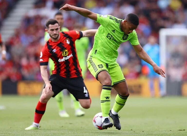 Anthony Martial dribbles away from Bournemouth defender