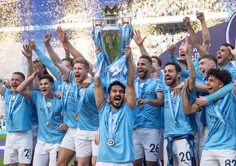 Ilkay Gungodan lifts the Premier League trophy for Manchester City