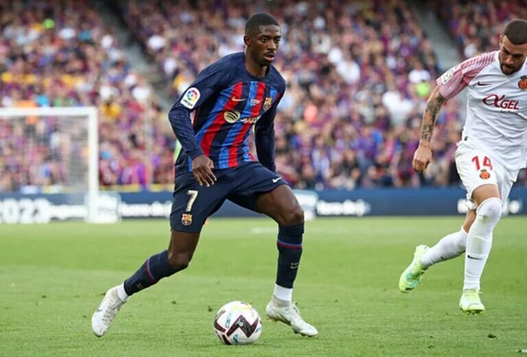 Ousmane Dembele dribbling with the ball