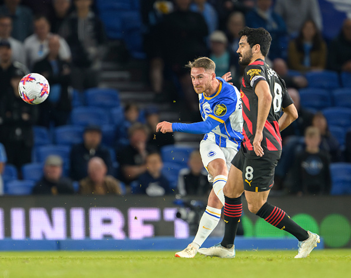 Brighton player Alexis Mac Allister taking a shot in a Premier League match vs Manchester City