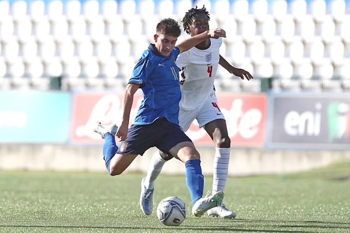 Callum Olusesi, pictured playing for England U16s, is signing a contract extension at Tottenham despite interest from Manchester United