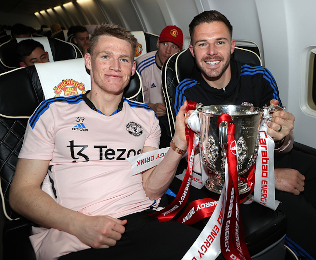 Jack Butland, whose imminent departure was cause for the latest Manchester United transfer update, holding the Carabou Cup trophy with Scott McTominay
