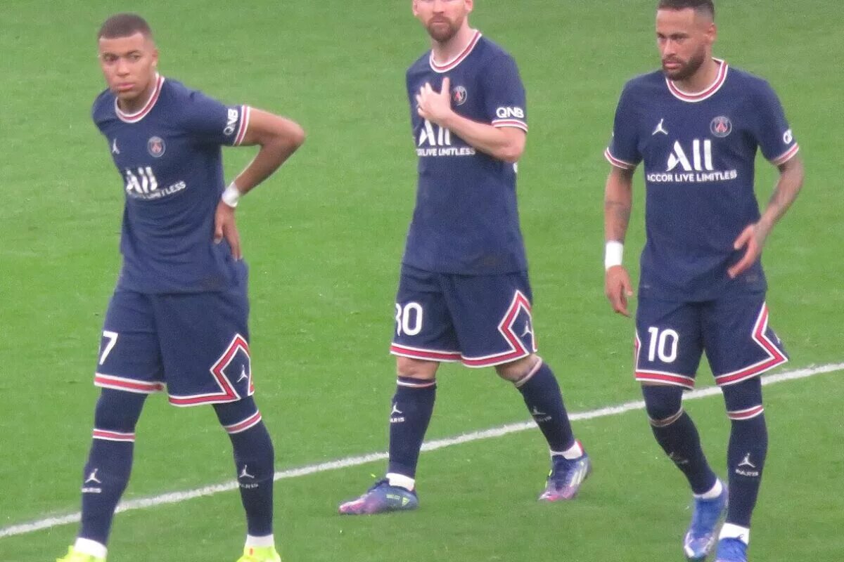 Kylian Mbappe next to teammates Lionel Messi and Neymar