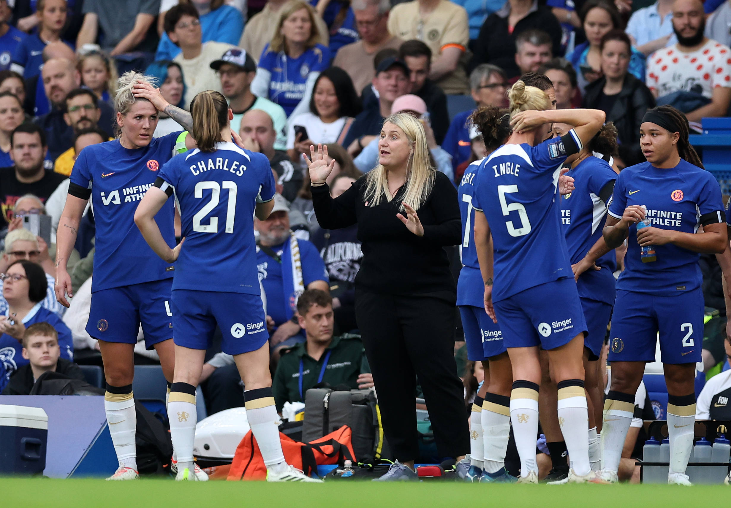 Chelsea Women take a water break and recieve instructions from manager emma Hayes