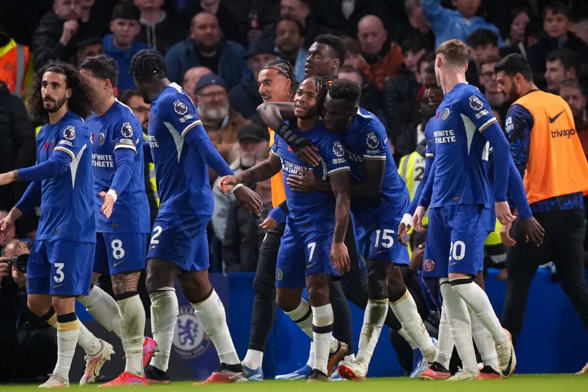 Chelsea players celebrate together following goal