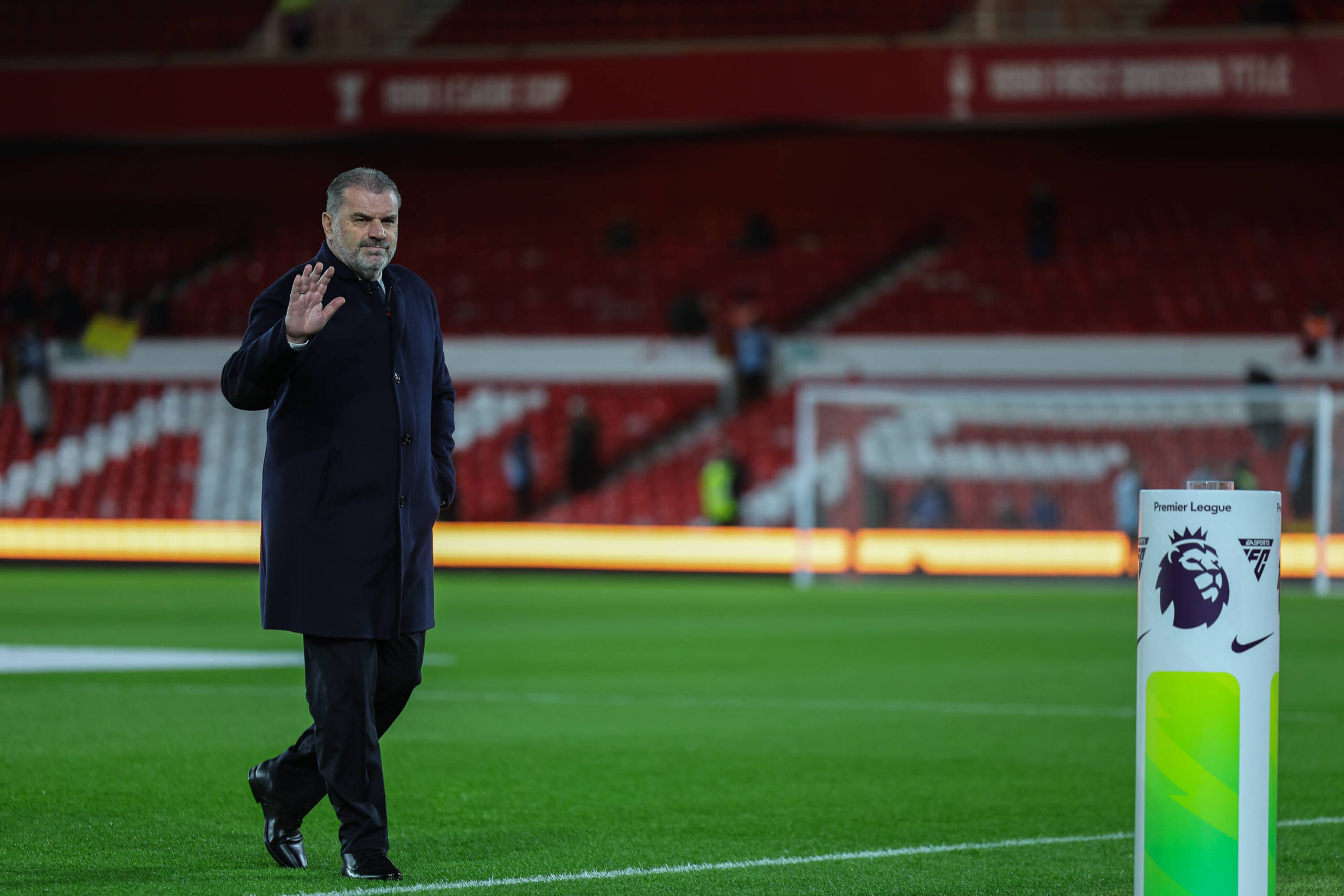 Ange Postecoglou waves as he leaves the pitch