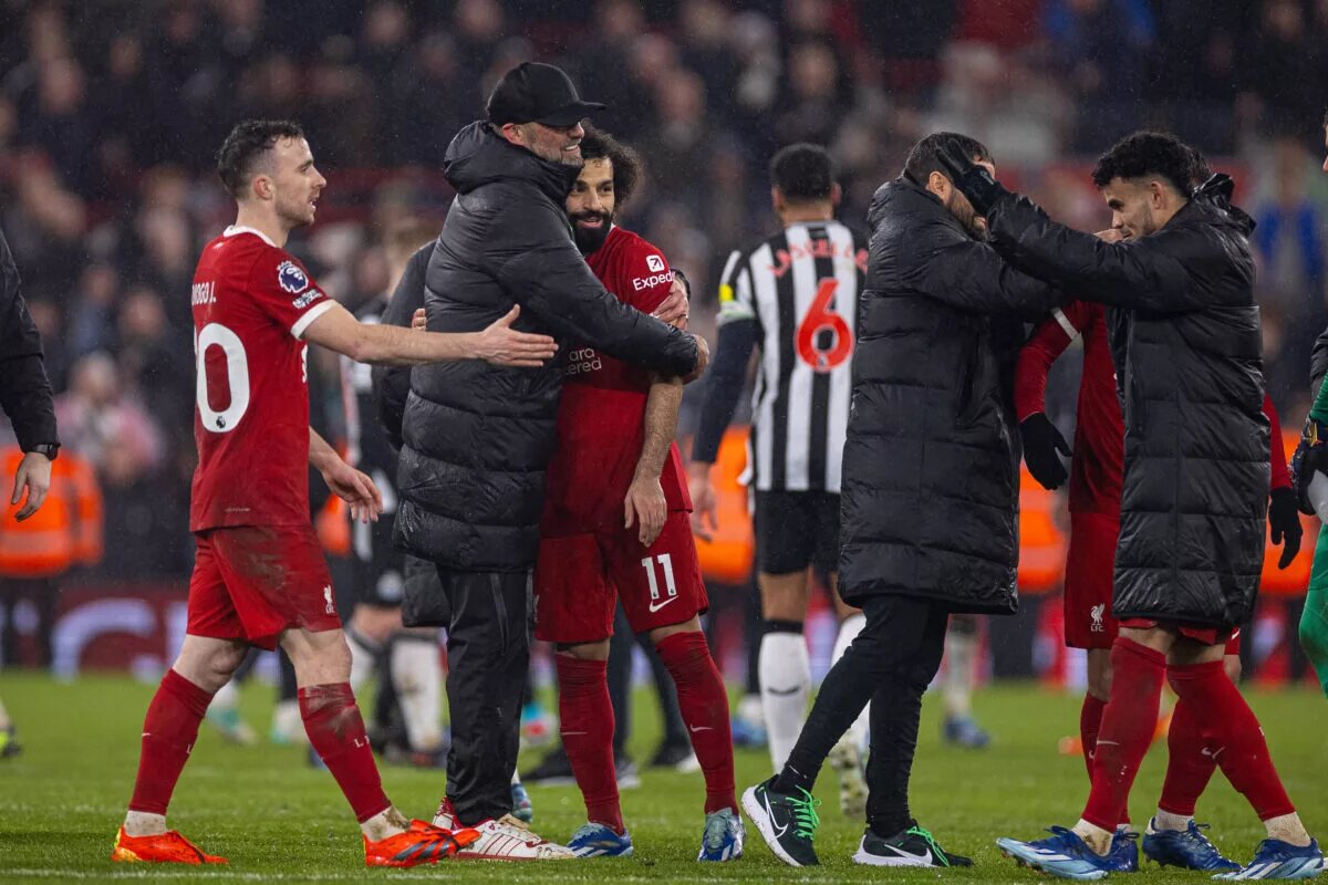 Jurgen Klopp embraces players after a win
