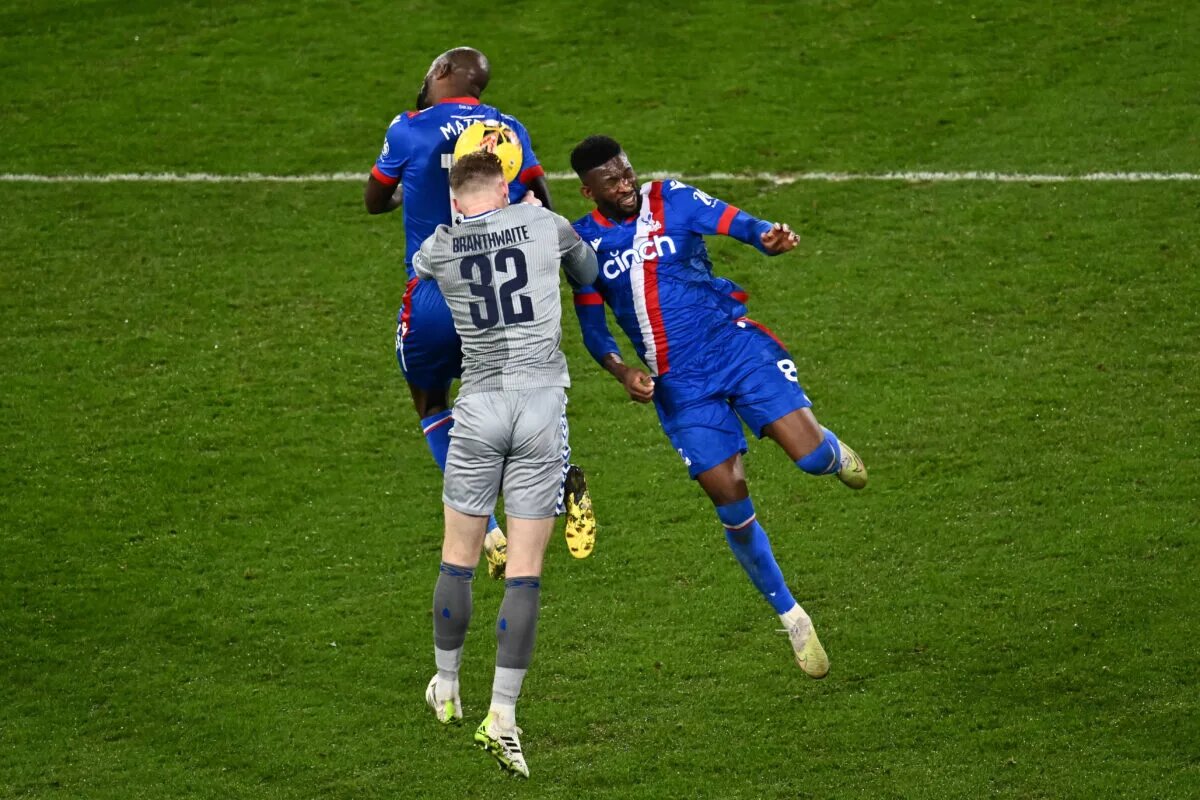 Everton's Jarrad Brantwaithe rises to head the ball against two opposition players